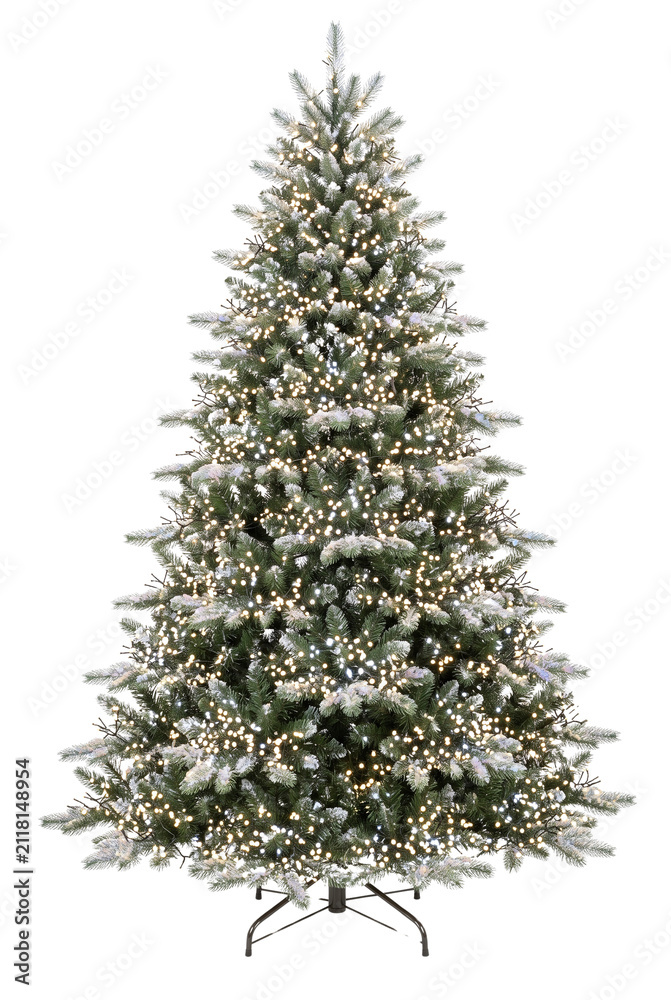 Obraz premium Flocked Christmas tree illuminated with warm white fairy lights