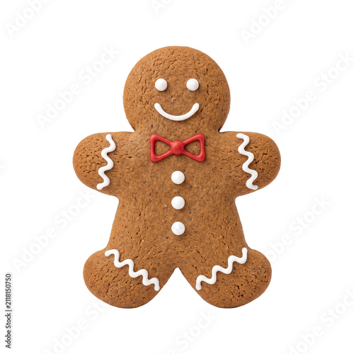 Traditional gingerbread man cookie with white icing and red bow