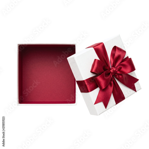 Open white gift box with red bow and velvet interior