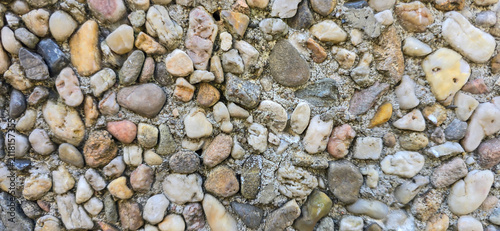Fotografie Pebble dash wall texture creating abstract pattern background
