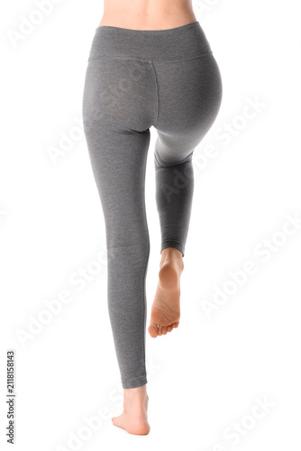 Woman in gray yoga pants wi...