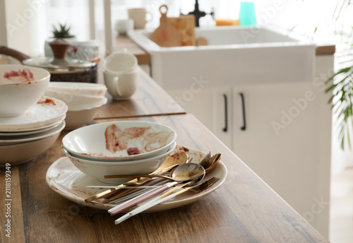 Pile of dirty dishes and cu...