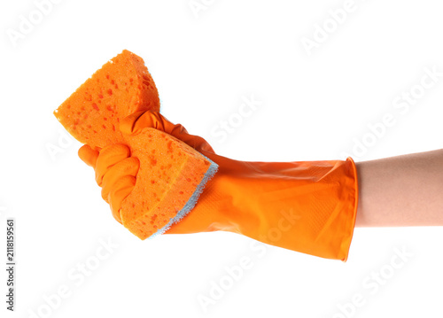 Obraz na płótnie Hand in orange rubber glove holding a cleaning sponge, household chores and hygi
