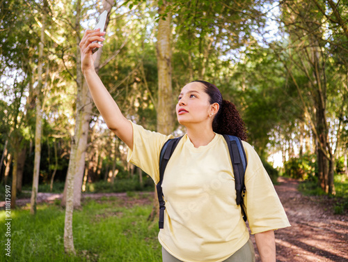 Photography Young woman lost and trying get signal from her smartphone