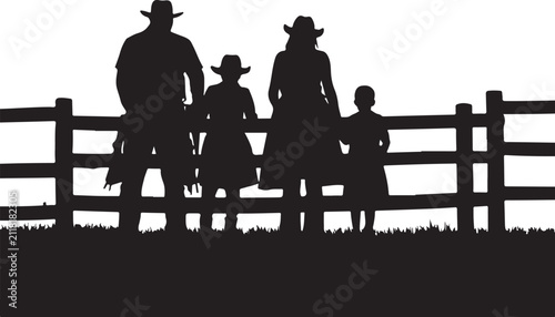 Silhouette of a western family of four standing behind a wooden fence on a white