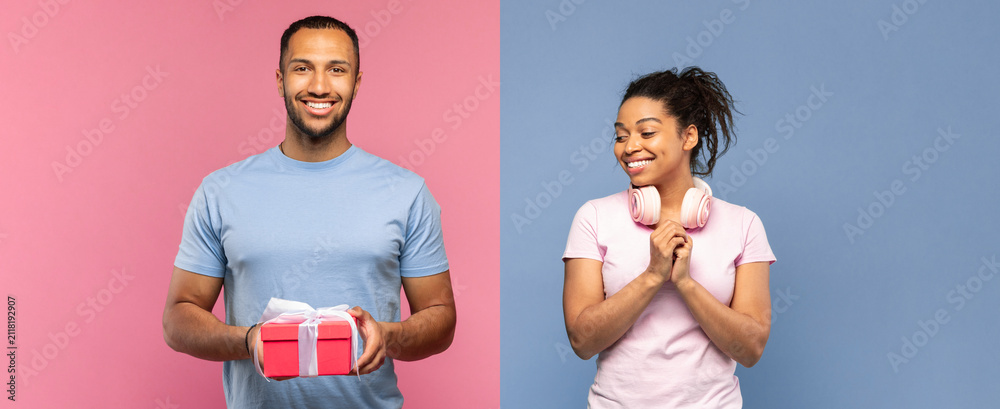 Obraz premium Smiling Man Of Mixed Ethnicity Holding Gift Box While Happy Woman Of African Descent With Headphones Looks Excited, Set Against Bright Colorful Background. Celebration Concept.