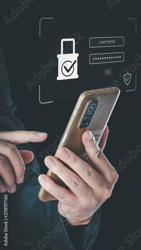 A person uses a smartphone with a virtual holographic interface displaying a secure login screen with username, password fields, and a padlock icon.