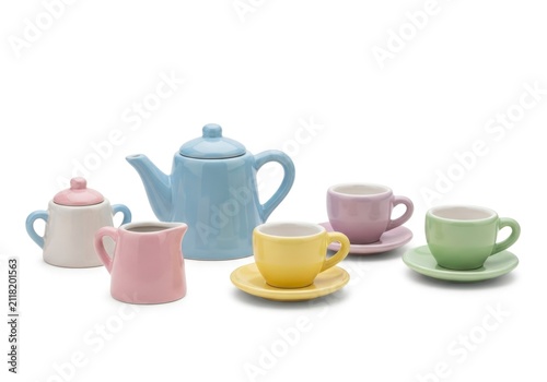 Colorful Miniature Ceramic Tea Set on White Background.