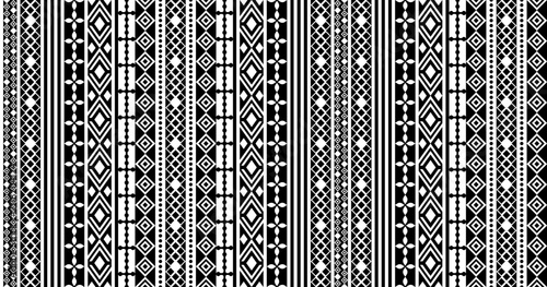 Black and white tribal geometric seamless pattern with vertical ethnic stripes for textile, fabric, fashion, clothing, wallpaper, and surface design.