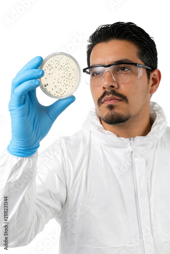 Professional Male Scientist in Protective Suit Examining Petri Dish with Bacterial Culture Isolated