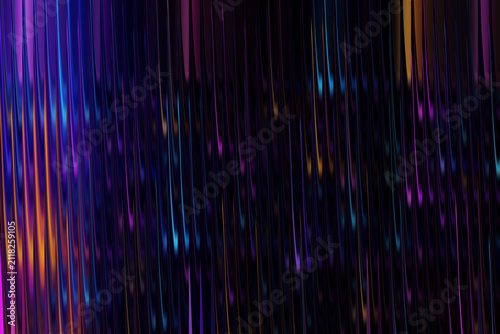 Abstract streaks of vibrant neon light trails against a dark background with bokeh effect