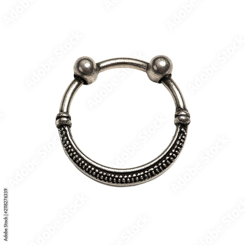 Ornate, circular silver bracelet with a textured, beaded design. Two spherical adornments top the ring