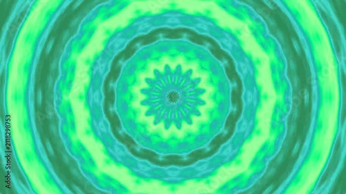 Pulsating abstract mandala motion background with green and teal geometric patterns.