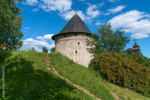 фотографія Tailovskaya Tower of the Holy Dormition Pskov-Pechersk Monastery on a sunny summ