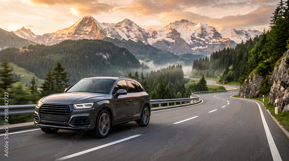 Naklejka premium Generic luxury modern crossover SUV driving along a winding asphalt road through high mountains at sunset