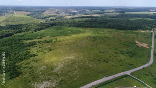 Orbiting drone over countryside field