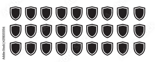 Fotografía Row of shield icons in black and silver outlines for security and defense