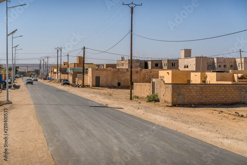 Atar city street in Mauritania, a small town in West Africa Sahel region, with dusty road during the hot summer day.
