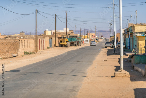 Atar city street in Mauritania, a small town in West Africa Sahel region, with dusty road during the hot summer day.
