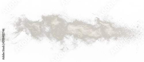 Beige powdery material against a black backdrop, elongated. Edges have scattered dust particles, creating a blurred, abstract composition