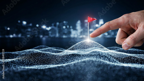 Human finger pointing at a red flag planted on a glowing digital particle mountain peak, with a blurred city skyline in the background