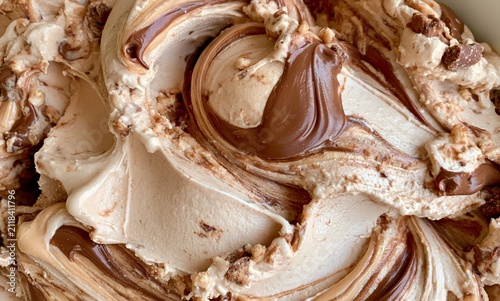 Kinder Bueno style ice cream, filling the entire frame. the ice cream has a creamy milk chocolate and hazelnut base with soft beige and light cocoa tones