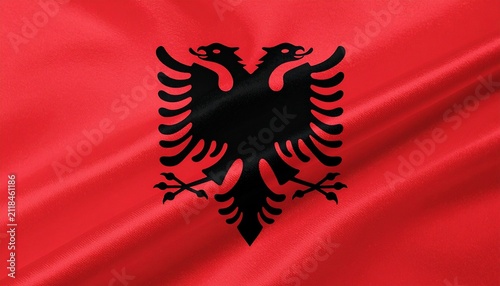 Albanian flag with red field and black double‑headed eagle emblem, symbolizing bravery, sovereignty, independence, resilience, and cultural identity…