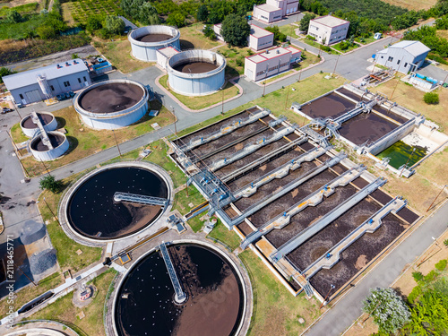 Photography Wastewater treatment facility in operation with several tanks and processing uni
