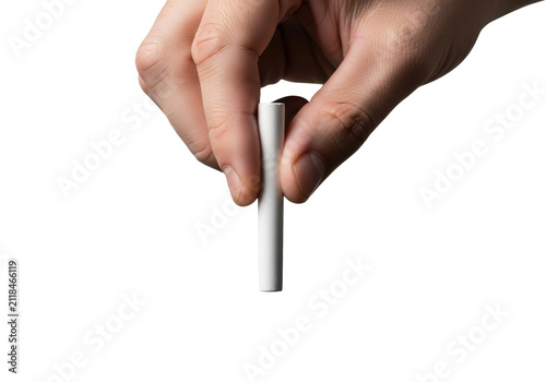 extreme close-up macro of a caucasian man's hand holding white chalk, poised over a black chalkboard, isolated on a white background with copy space. concept of education and knowledge transfer.