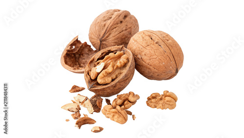 Assortment of fresh organic brown whole walnuts isolated on transparent background