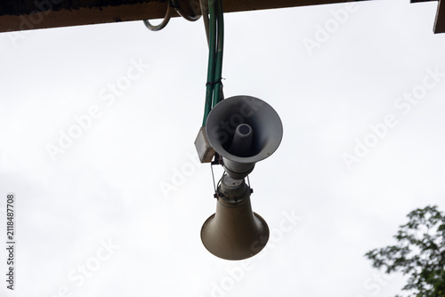 Картината върху платно Railway public address loudspeaker mounted on a station platform for passenger announcements, highlighting railway communication, public safety, transportation infrastructure, and travel information