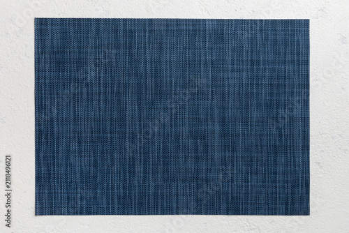Top view of grey tablecloth for food on cement background. Empty space for your design
