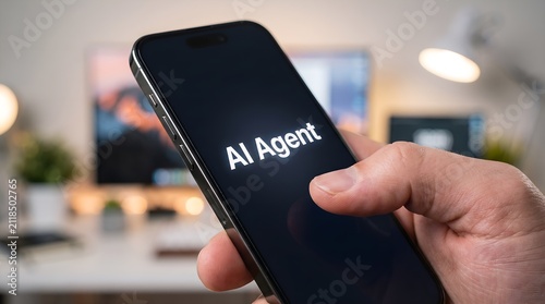 AI Agent mobile application on smartphone screen held by hand in a blurred modern office workspace