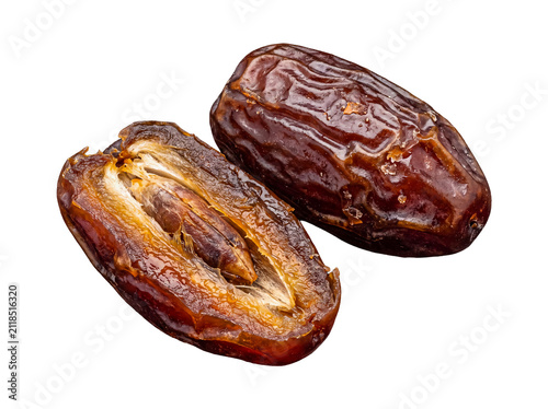 фотографія High-detail photograph of one whole dried date alongside a split date, prominently revealing its sweet