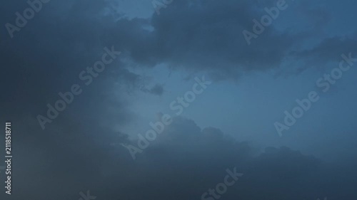 Blue cumulus and cumulonimbus in the sky at dusk