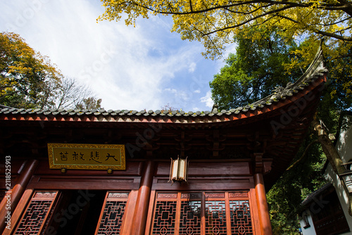 Traditional Chinese temple under autumn trees in Hangzhou, China