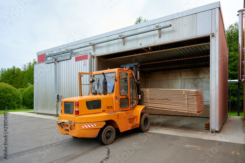 Quadro su tela Forklift loading lumber into a drying kiln for wood processing