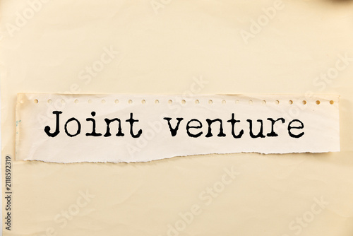 Obraz na płótnie white paper with joint venture text