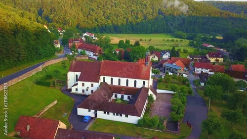 Aerial view of Schönau Abbey in the Saale Valley.
