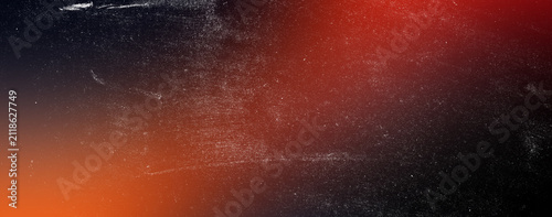 Fotografie Dramatic red and black film grain texture with intense light leaks and dusty surface ideal for horror movie posters and high contrast vintage photography overlays for creative art