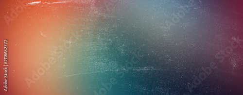 Multi colored abstract gradient background blending orange teal and deep purple with retro film grain overlay texture for stylish artistic backdrop in digital art or social projects.