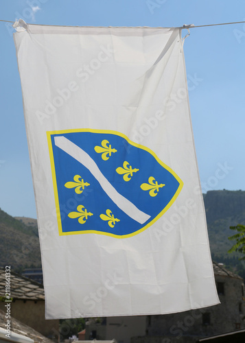 Colorful Flag of Bosniaks flying in the air in Mostar, Bosnia and Herzegovina