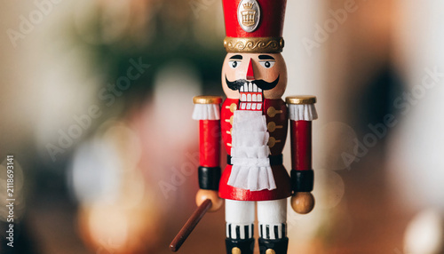 Close up of classic holiday soldier figure with ornate uniform with intricately designed soldier figurine festive attire warm toned background subtle decorative elements