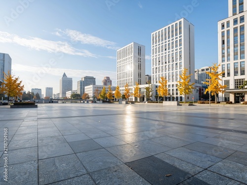 Modern city square and high-rise buildings in autumn sunlight