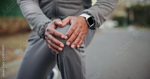 Fitness, hands or man with knee pain in road for muscle spasm, tissue overload or runner injury. Cramp, athlete or tendon discomfort outdoor for cardio accident, kneecap strain or patellar tendinitis
