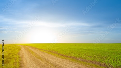 green spring rural field scene at the sunset time lapse scene