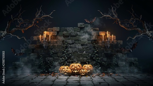 A spooky halloween background featuring glowing carved pumpkins on a stone floor with dark misty atmosphere and old tree branches