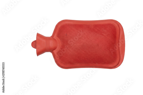 Fotografie Classic red rubber hot water bottle with ribbed texture for warmth and comfort