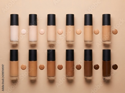 Foundation makeup bottles arranged by skin tone with matching pigment swatches below.