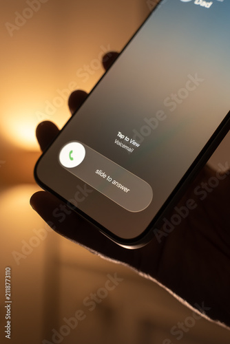 Person Receiving and Answering an Incoming Call on a Smartphone.